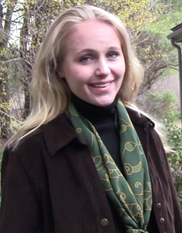 Green Winter Essence silk scarf worn by model for elegant winter styling